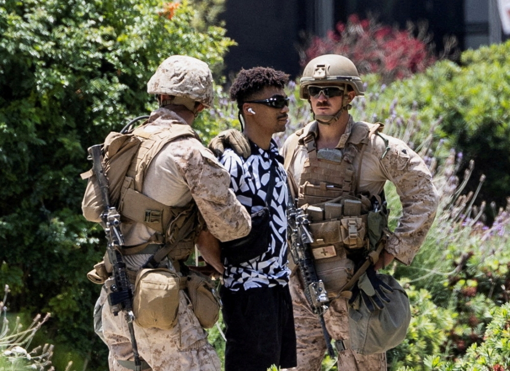 US Marines detain Marcos Leao, a 27-year-old veteran, outside the Wilshire Federal Building after Marines were deployed to Los Angeles, as protests against federal immigration sweeps continue, in Los Angeles, California June 13, 2025. — Reuters pic  