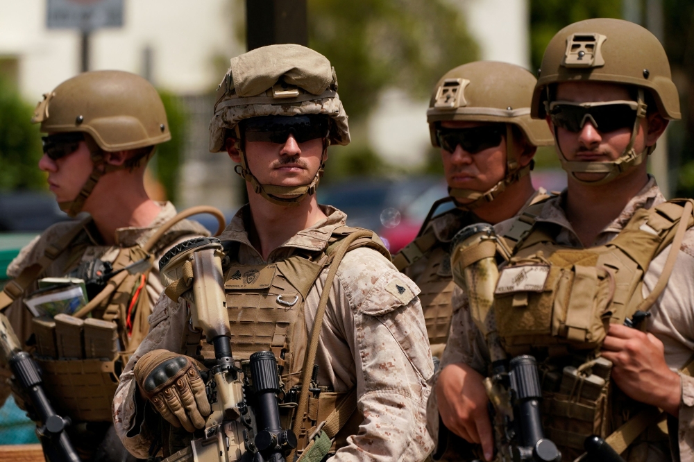 US Marines stand guard outside the Wilshire Federal Building, after they were deployed to Los Angeles as federal immigration sweeps continue, in Los Angeles, California June 13, 2025. — Reuters pic  