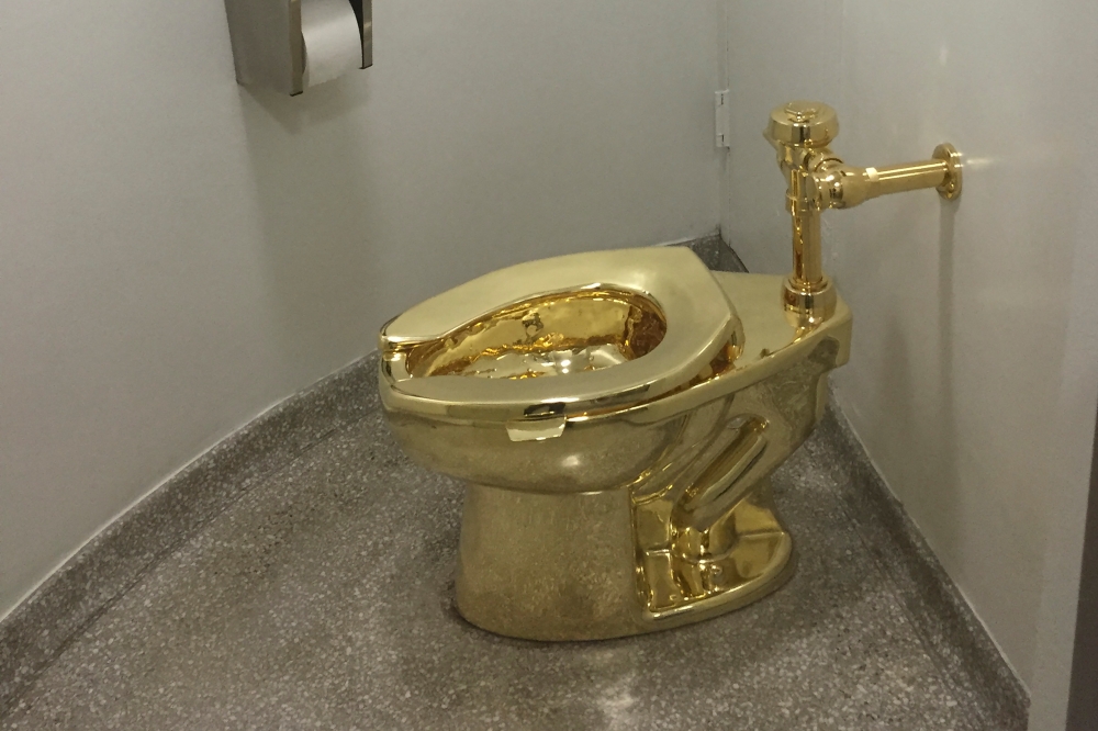 File picture of a fully functioning solid gold toilet, made by Italian artist Maurizio Cattelan, at the Guggenheim Museum in New York September 15, 2016. Two men were jailed yesterday for stealing an 18-carat golden toilet that had been on display as an artwork in an exhibition at Winston Churchill’s birthplace. — AFP pic