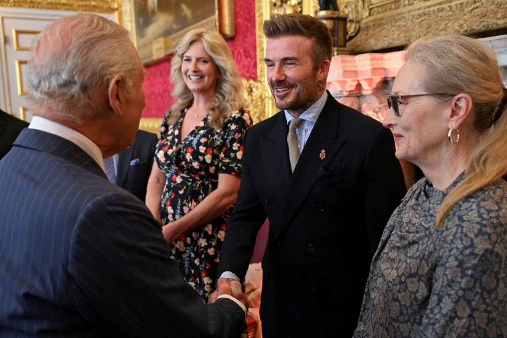 David Beckham shakes hands with Britain’s King Charles, next to Meryl Streep, as they attend the King’s Foundation Awards ceremony, on the 35th anniversary of The King’s Foundation, in London June 12, 2025. — AFP pic