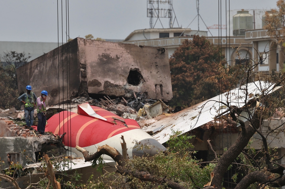 Members of Indian Army's engineering arm prepare to remove the wreckage of an Air India aircraft, bound for London's Gatwick Airport, which crashed during take-off from an airport in Ahmedabad, India June 14, 2025. — Reuters pic