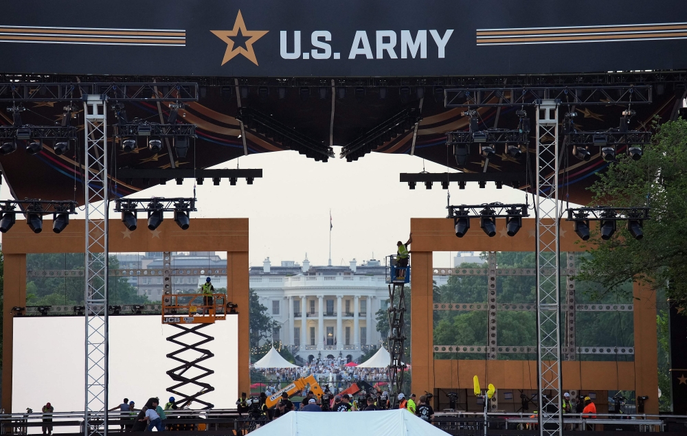 Production crews work on the stage ahead the US Army’s 250th Anniversary Parade. — AFP pic