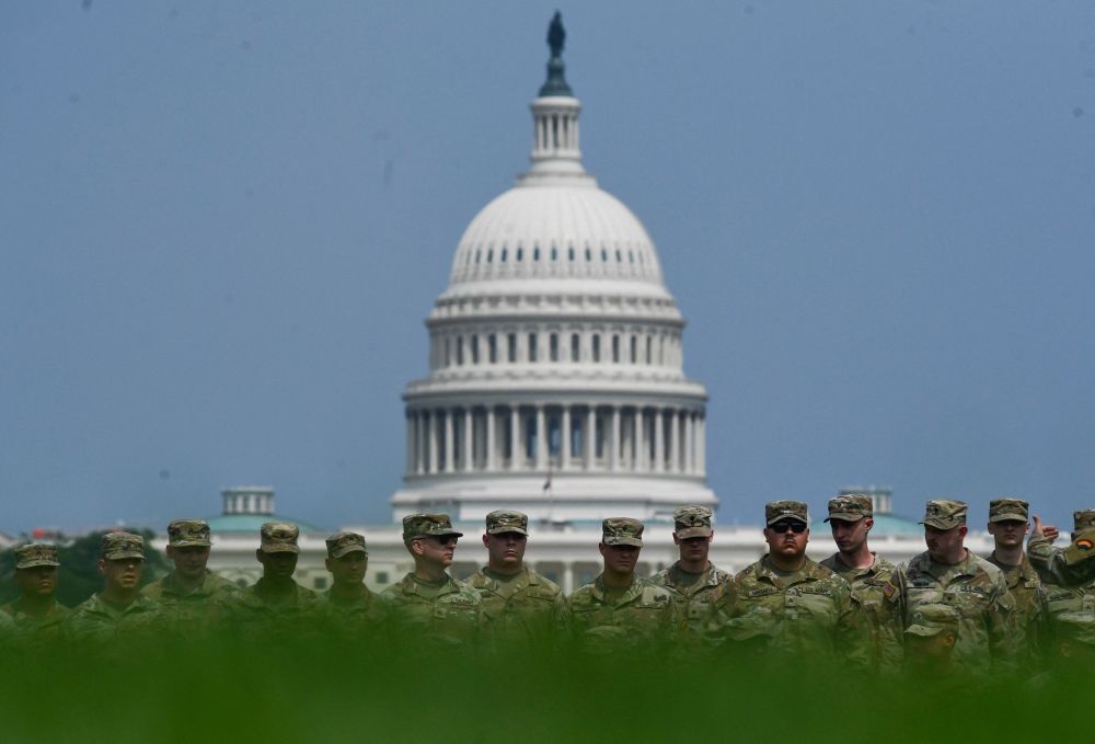 Soldiers pose for a group photo on the National Mall in Washington. — AFP pic