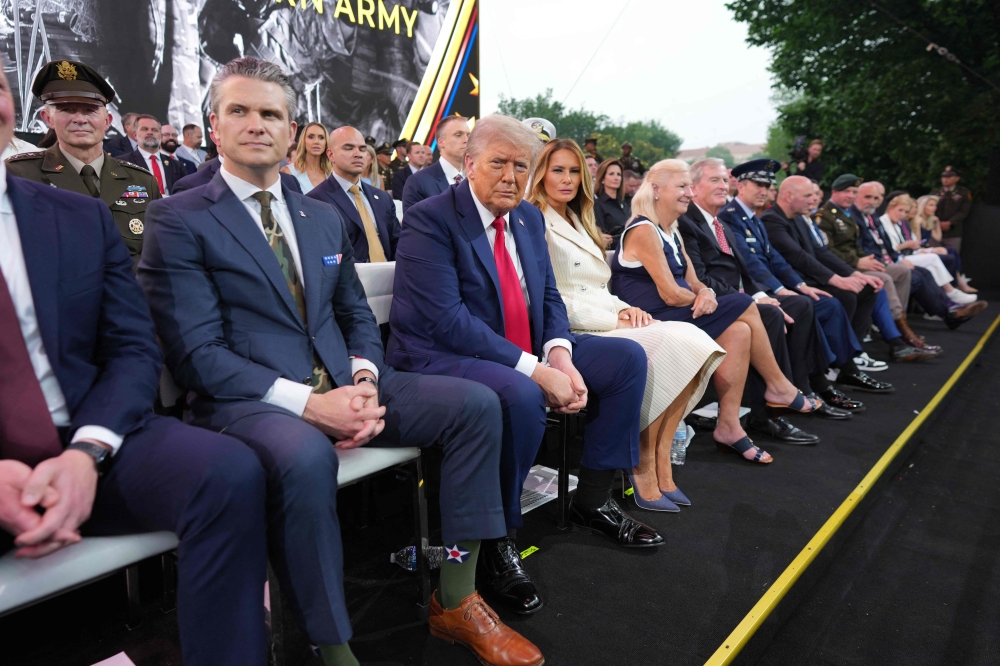 (From left) US Secretary of Defense Pete Hegseth, US President Donald Trump and First Lady Melania Trump attend the Army 250th Anniversary Parade in Washington, DC June 14, 2025. — Doug Mills/Pool/AFP pic 
