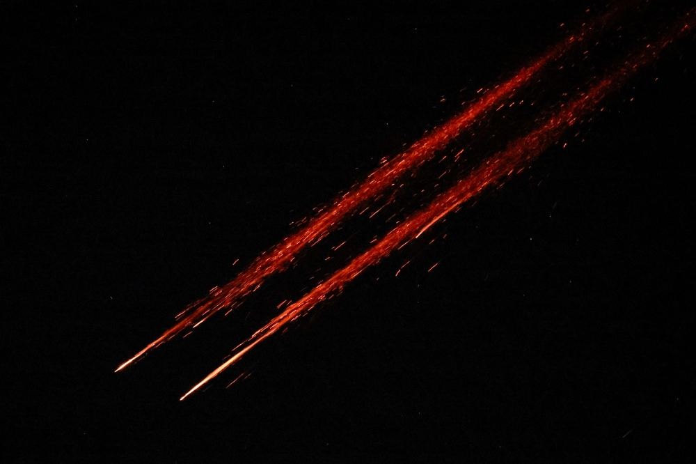 Missiles launched from Iran towards Israel are seen from Tubas, in the Israeli-occupied West Bank, June 14, 2025. — Reuters pic 