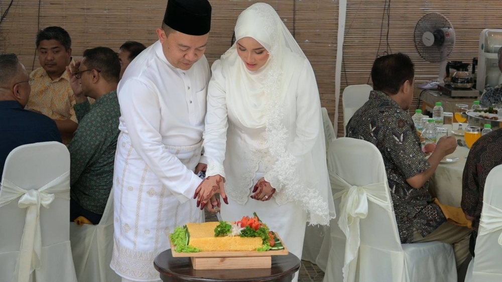 Tasek Gelugor MP Datuk Wan Saiful Wan Jan (left) and his new bride Nurul Maslina Mohd Sobri celebrate their wedding in Kajang, Selangor on June 14, 2025. — Picture from Facebook/Wan Saiful Wan Jan