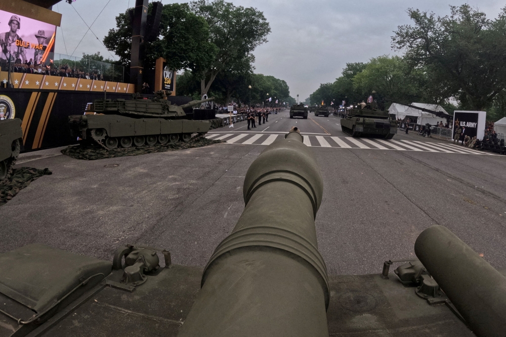 Members of the US Army’s Charlie Company, 2nd Battalion, 5th Cavalry Regiment, 1st Armoured Brigade Combat Team, 1st Cavalry Division operate a M1A2 SEP V3 tank down Constitution Avenue as they move past US President Donald Trump during the Army’s 250th Birthday parade in Washington, D.C. June 14, 2025. Trump warned Iran today that it would experience ‘the full strength’ of the US military if it attacks the United States, reiterating that Washington ‘had nothing to do’ with Israel’s strikes on Tehran’s nuclear and intelligence facilities. — Reuters pic