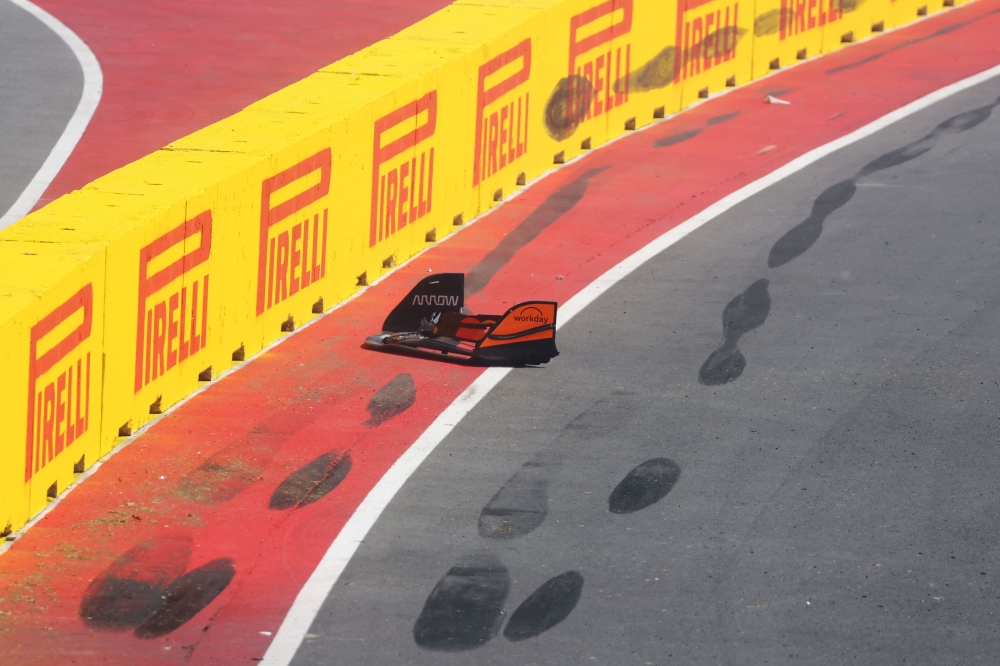 Skid marks and the front wing of Lando Norris’sMcLaren MCL39 Mercedes race car was left behind on the circuit after he hit the wall during the F1 Grand Prix of Canada on June 15, 2025 in Montreal. — AFP pic