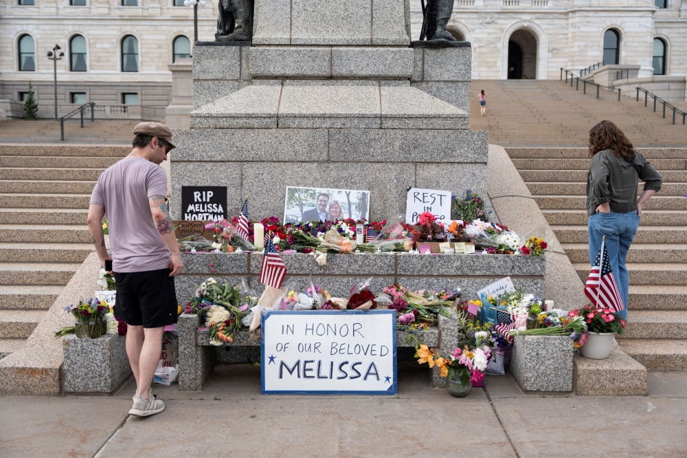 People pay their respects at a memorial outside the Minnesota State Capitol in honor of Democratic state assemblywoman Melissa Hortman and her husband Mark, after a gunman killed them, in St. Paul. — AFP pic