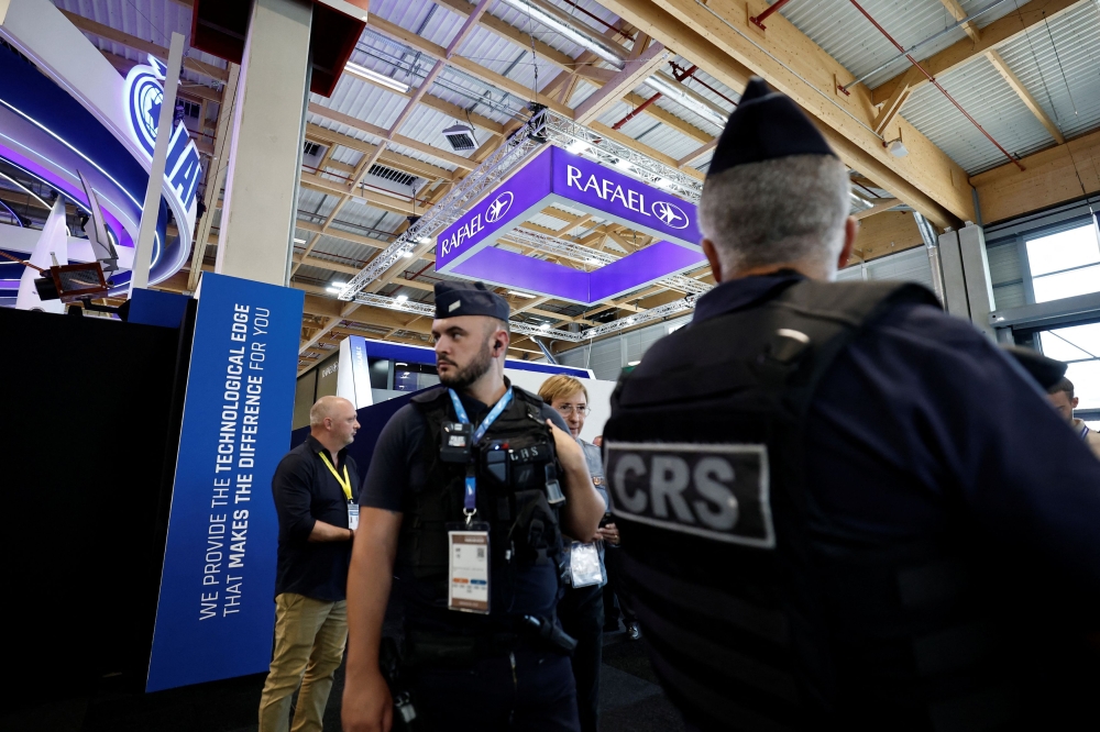 French police secure the area in front of the closed IAI and Rafael stands after the four main Israeli company stands at the Paris Airshow have been shut down by organisers during the 55th Paris Air Show at Le Bourget Airport near Paris June 16, 2025. — Reuters pic