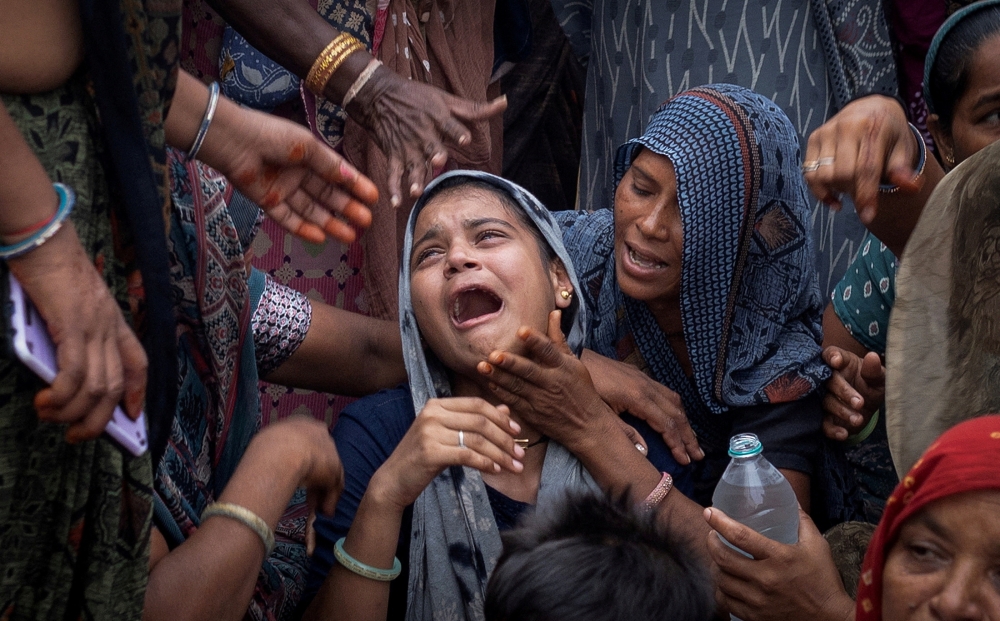 Dabu Patni, mourns as she waits for the body of her younger brother Akash Patni, 14, who died after an Air India Boeing 787-8 Dreamliner plane crashed during take-off from an airport, to arrive at his house for the last rites in Ahmedabad, India, June 15, 2025. — Reuters pic