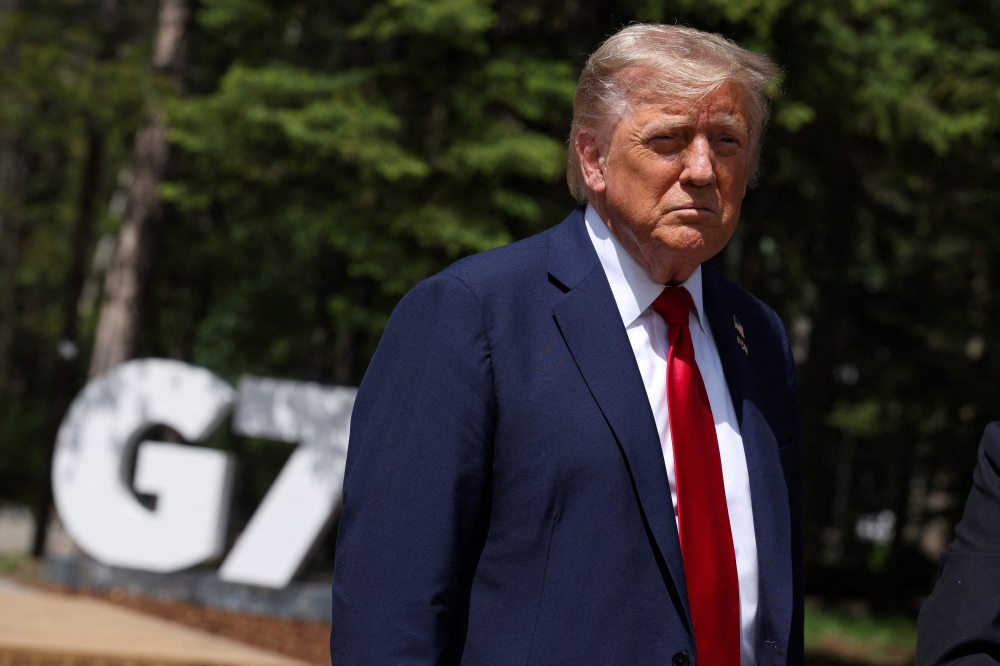 US President Donald Trump spoke to reporters during the Group of Seven (G7) Summit at the Pomeroy Kananaskis Mountain Lodge in Kananaskis, Alberta. — AFP pic