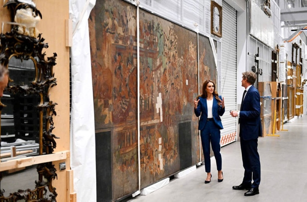 Britain’s Catherine, Princess of Wales on Tuesday talks with V&A Director Tristram Hunt as he shows her round the V&A East Storehouse, a brand-new cultural destination in east London. — AFP pic