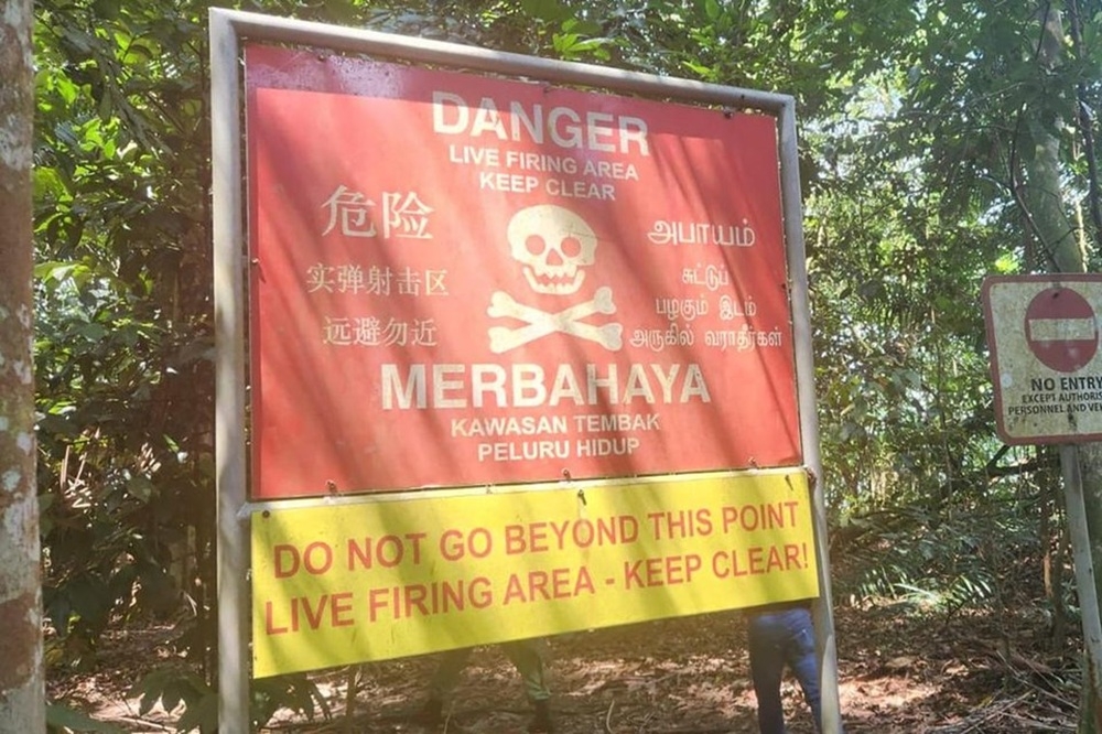 Prominent warning signs at Chestnut Nature Park in Singapore caution mountain bikers and hikers about nearby live-firing areas, yet some continue to enter restricted zones. — Picture courtesy of Singapore’s Ministry of Defence