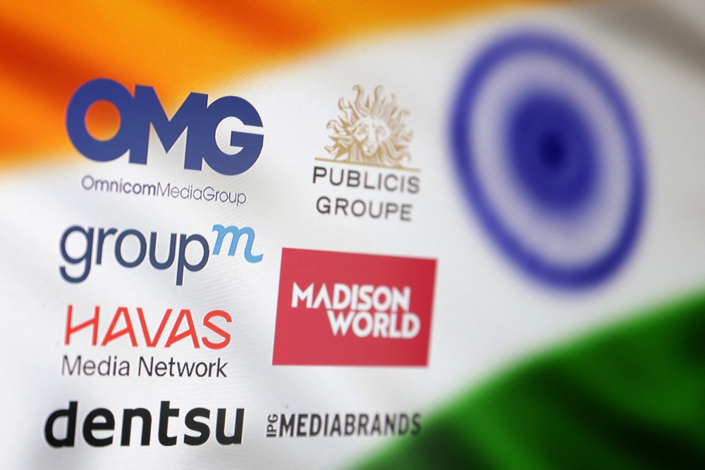 An Indian flag and advertising companies' logos are seen in this illustration taken June 18, 2025. — Reuters pic 