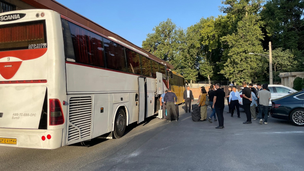 This handout photo taken on June 17, 2025 and provided by the South Korean Foreign Ministry on June 19, 2025 shows South Koreans and their Iranian family members boarding a bus in Tehran during their evacuation from Iran to Turkmenistan. — South Korean Foreign Ministry handout/AFP pic 