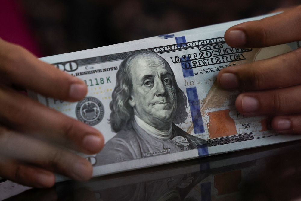 The dollar index comparing the US currency against six others is poised for a 0.5 per cent climb this week. The conflict between Israel and Iran shows no signs of subsiding and market participants are nervous about potential US intervention in the region. — Reuters pic