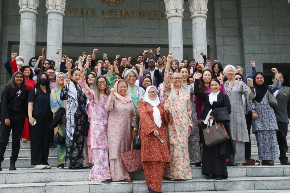Sisters in Islam and its supporters celebrating after the Federal Court's landmark decision on the ‘deviant’ fatwa against the group at Palace of Justice, Putrajaya. June 20, 2025. — Picture by Choo Choy May