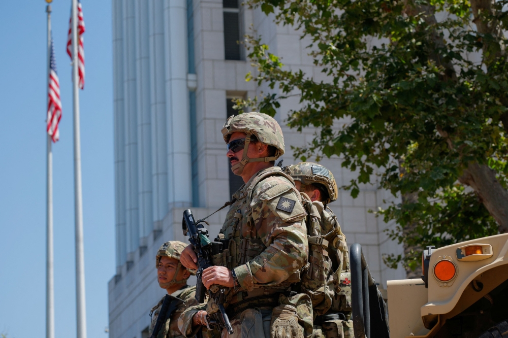 Members of the California National Guard are deployed outside a complex of federal buildings in Santa Ana, California June, 18, 2025. — Reuters pic