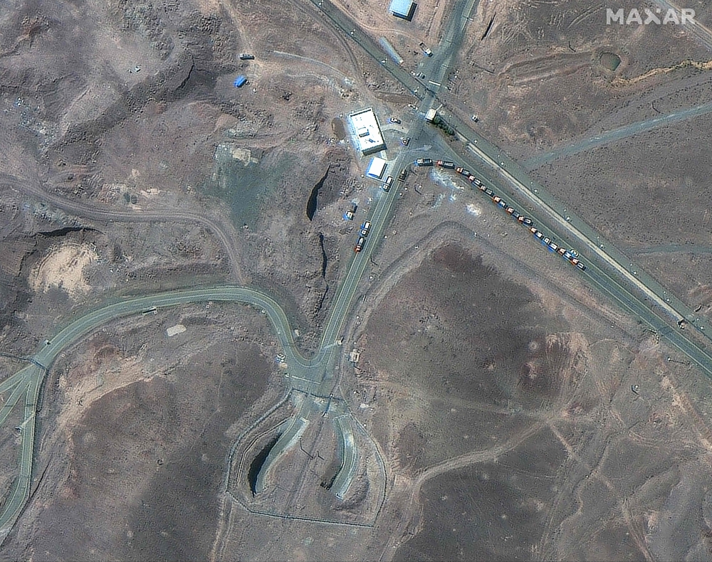 This handout satellite picture provided by Maxar Technologies and taken on June 19, 2025, shows trucks positioned near the entrance of Iran’s Fordow Fuel Enrichment Plant (FFEP), northeast of the city of Qom. — AFP pic