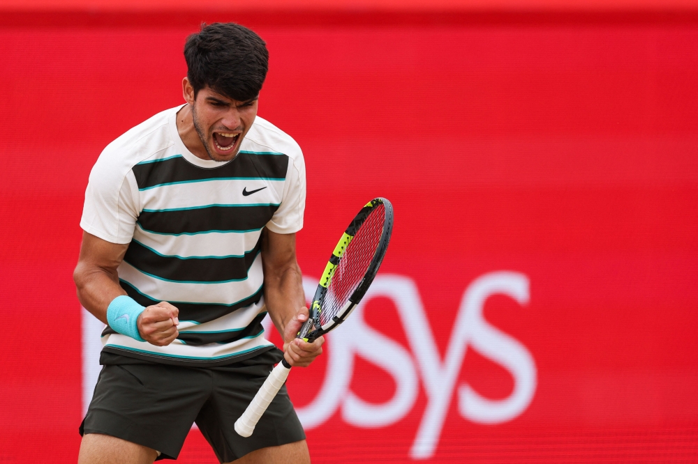 Spain’s Carlos Alcaraz celebrates after winning against  Czech Republic’s Jiri Lehecka at the end of their men’s singles final tennis match at the HSBC ATP tennis Championships at Queen’s Club in west London on June 22, 2025. — AFP pic 