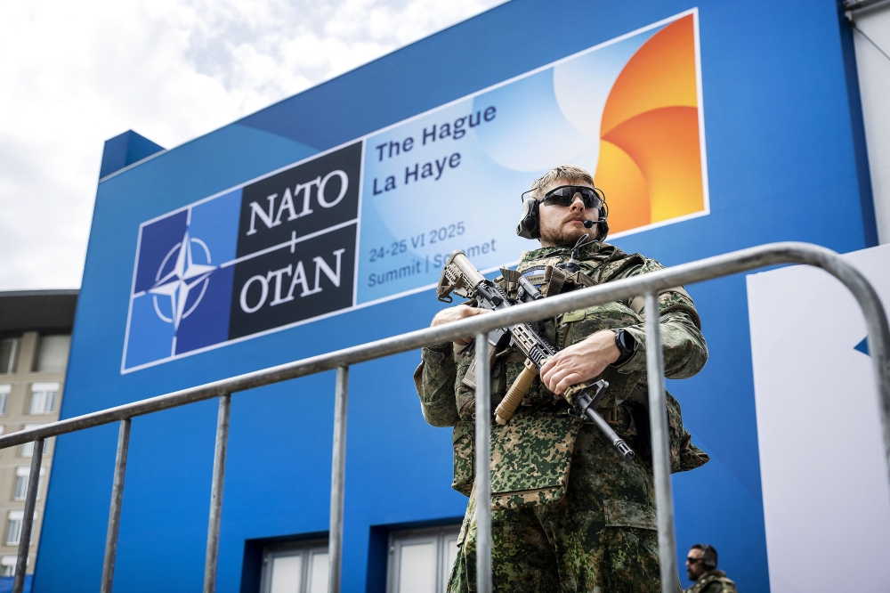 A Nato military force stands guard ahead of the two-day Nato summit at the World Forum, in The Hague, on June 22, 2025. — AFP pic
