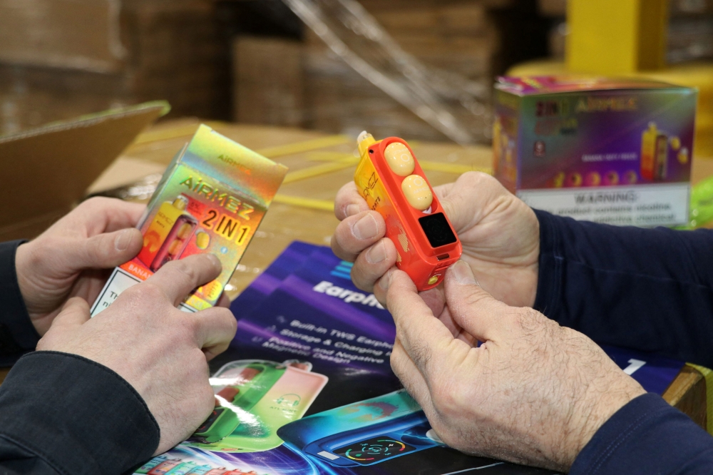 Officials exhibit Chinese-made vapes seized in a raid outside of Chicago, Illinois, in this handout photo released on June 17, 2025. —Reuters pic