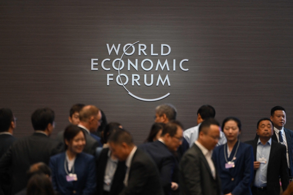 Attendees arrive ahead of the opening ceremony of the World Economic Forum Annual Meeting of the New Champions (AMNC25) in Tianjin on June 25, 2025. — AFP pic 