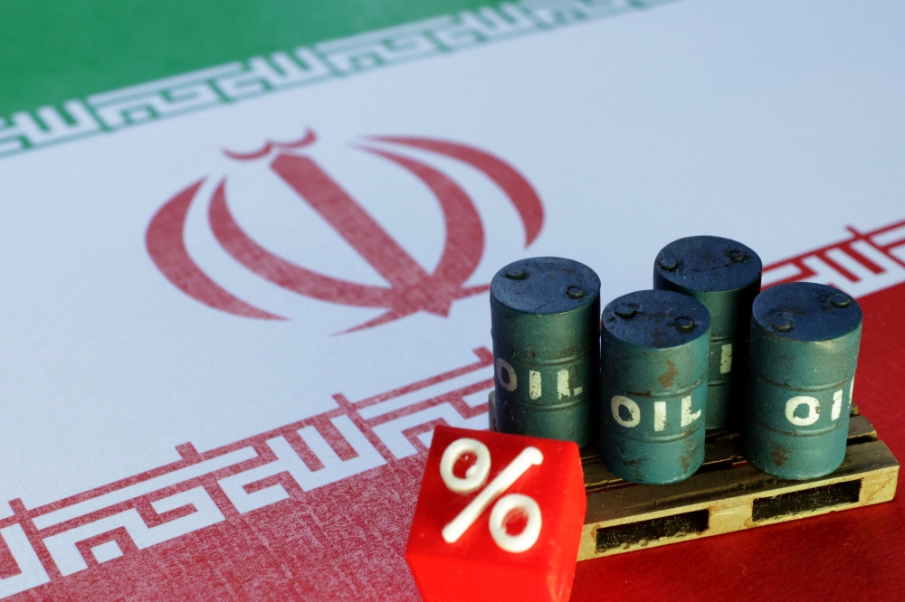 Iranian flag and 3D printed oil barrels miniature are seen in this illustration taken June 23, 2025. — Reuters pic