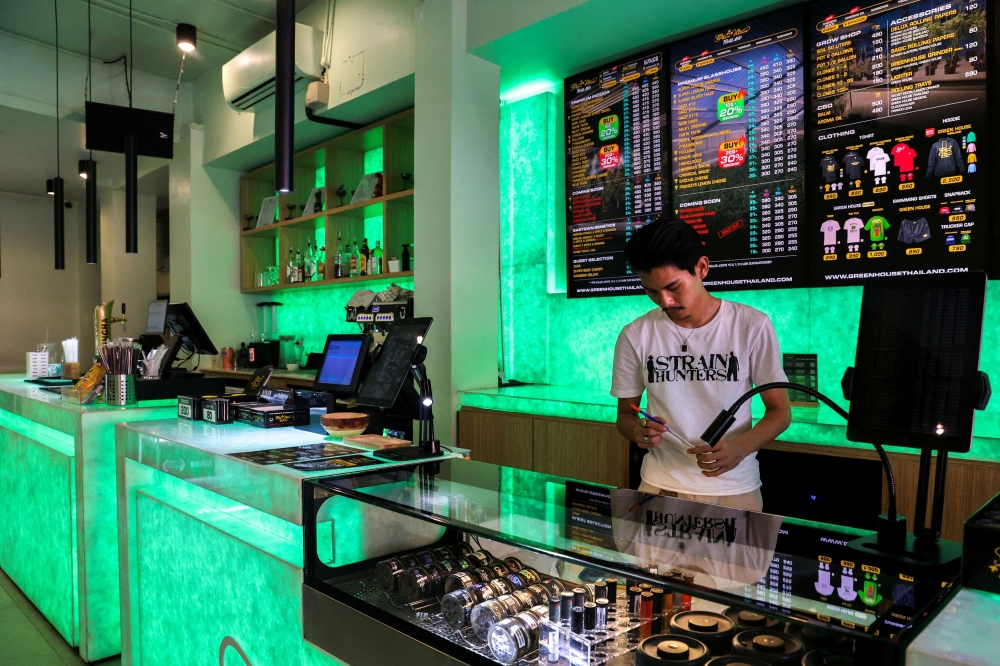 — Reuters pic  Punnathat Phutthisawong, a staff member at a cannabis shop called ‘Green House Thailand’ arranges cannabis inside his shop on Khaosan Road, one of the favourite tourist spots in Bangkok, Thailand, June 25, 2025. — Reuters pic  