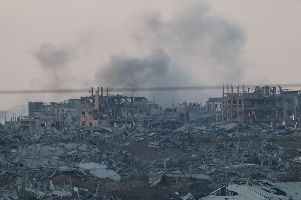 Buildings lie in ruin inside the Gaza strip, as seen from Israel, June 25, 2025. — Reuters pic