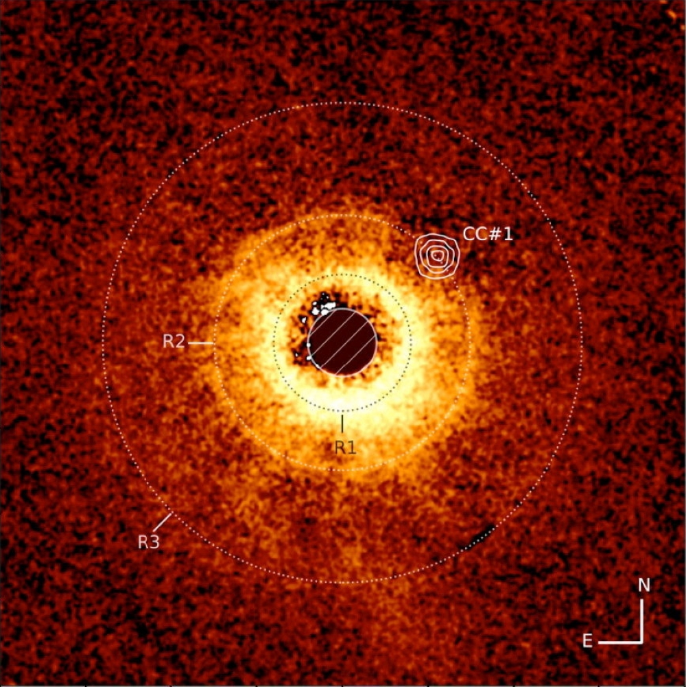 An image of the protoplanetary disk around the star TWA 7, recorded using the European Southern Observatory’s Chile-based Very Large Telescope’s SPHERE instrument, is seen with an image captured with the James Webb Space Telescope’s MIRI instrument overlayed in this image released on June 25, 2025. The empty area around exoplanet TWA 7 B is shown in the R2 ring, CC #1. — AM Lagrange et  al/JWST/ESO handout via Reuters