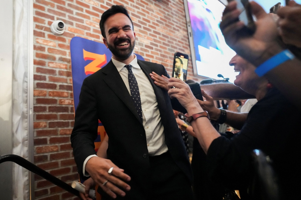 Zohran Mamdani reacts as he walks during a watch party for his primary election, which includes his bid to become the Democratic candidate for New York City mayor in the upcoming November 2025 election, in New York City, June 25, 2025. — Reuters pic 