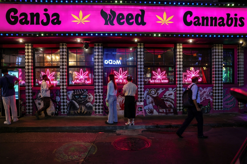 People walk past a cannabis shop on Sukhumvit Road, one of the most popular tourist spots in Bangkok, Thailand, June 25, 2025. — Reuters pic 