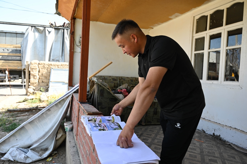 In a remote town in southern Kyrgyzstan, teacher Nur Akhmatov watched workers building a library, conference hall and women’s sports centre — construction mostly funded by Kyrgyz emigrants sending money home from Russia. — AFP pic