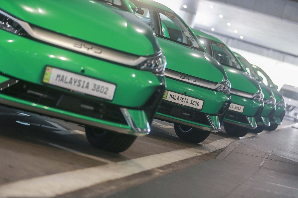 Grab EV drivers can pick up KLIA-bound customers when they head back to the airport. — Picture by Sayuti Zanudin