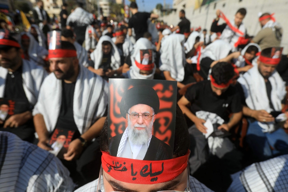 Supporters hold pictures of Iran’s supreme leader Ayatollah Ali Khamenei, during a rally outside the Iranian Embassy in Beirut to celebrate a ceasefire between Israel and Iran, on June 25, 2025. — AFP pic