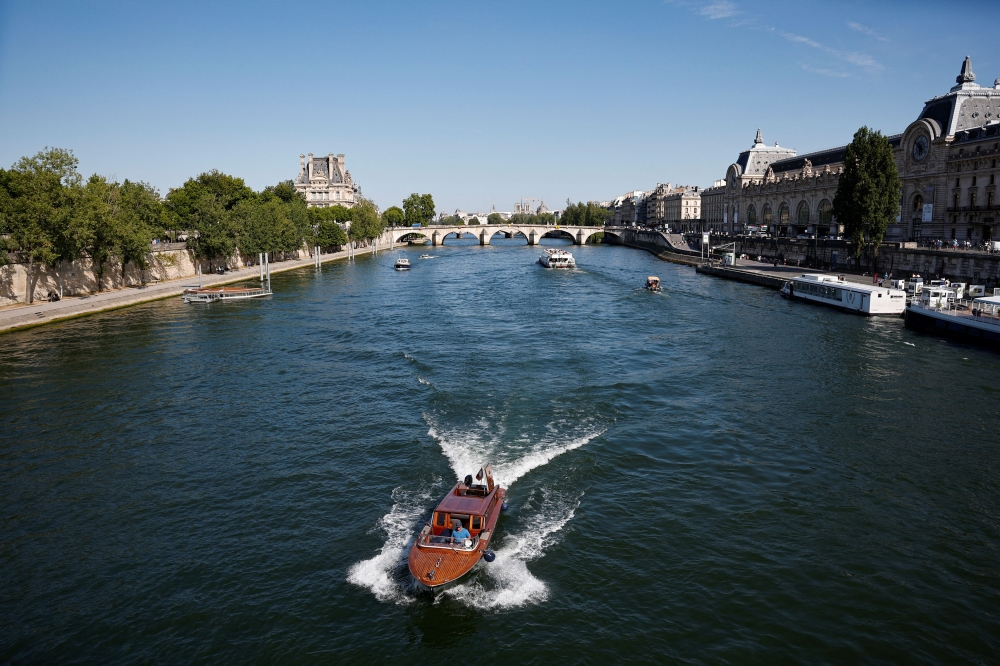 France will ban smoking on beaches and in parks, public gardens and bus shelters, among others. — Reuters pic