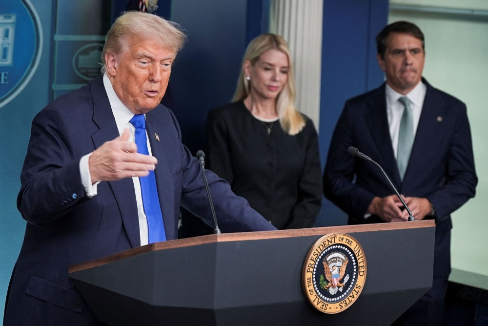 US President Donald Trump speaks to the media as US Attorney General Pam Bondi and US Attorney General Todd Blanche listen, after the US Supreme Court dealt a blow to the power of federal judges by restricting their ability to grant broad legal relief in cases as the justices acted in a legal fight over President Donald Trump’s bid to limit birthright citizenship, in the Press Briefing Room at the White House in Washington D.C. June 27, 2025. — Reuters pic 