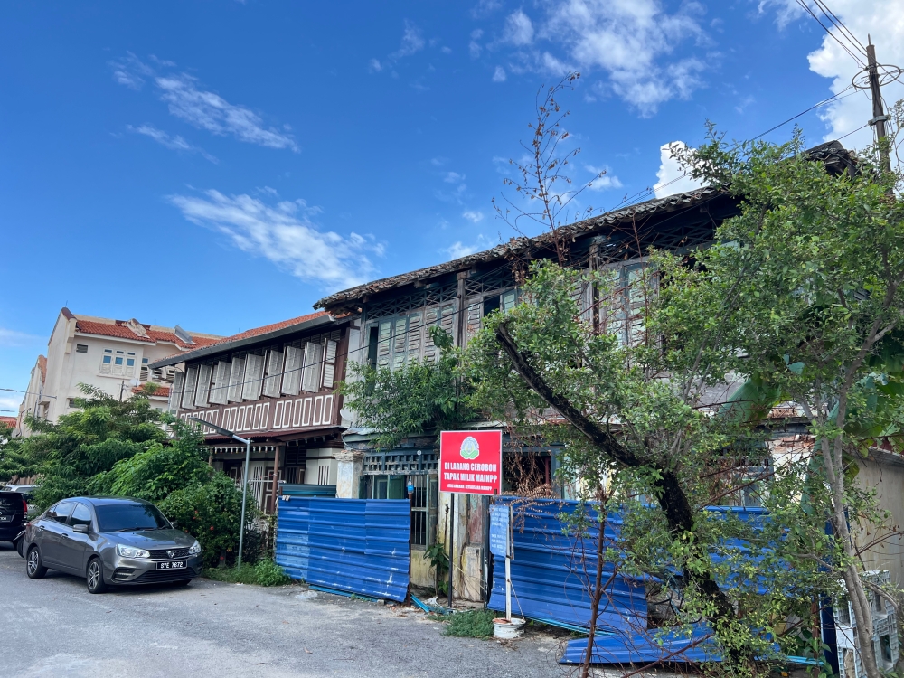 Traditional ‘kampung’ houses within the mosque compound remain today and the mosque committee is planning to restore the one vacant house and turn it into an Islamic religious school. — Picture by Opalyn Mok