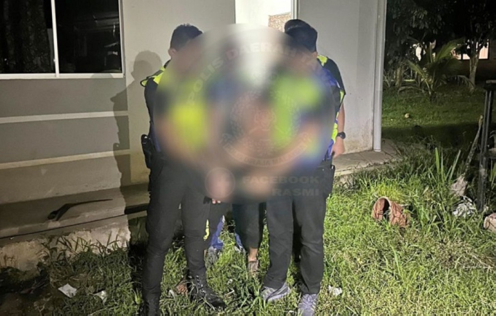 Tawau police arrest a 44-year-old man who ran away after his wife reported him for domestic violence and threats with bladed weapons on June 28, 2025. — The Borneo Post pic