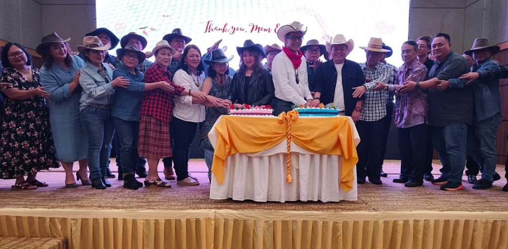 Telang Usan assemblyman Datuk Dennis Ngau (front, sixth right) during the cake-cutting ceremony at a PBB party celebration of Mother’s Day and Father’s Day dinner in Miri, Sarawak on June 27, 2025. — The Borneo Post pic