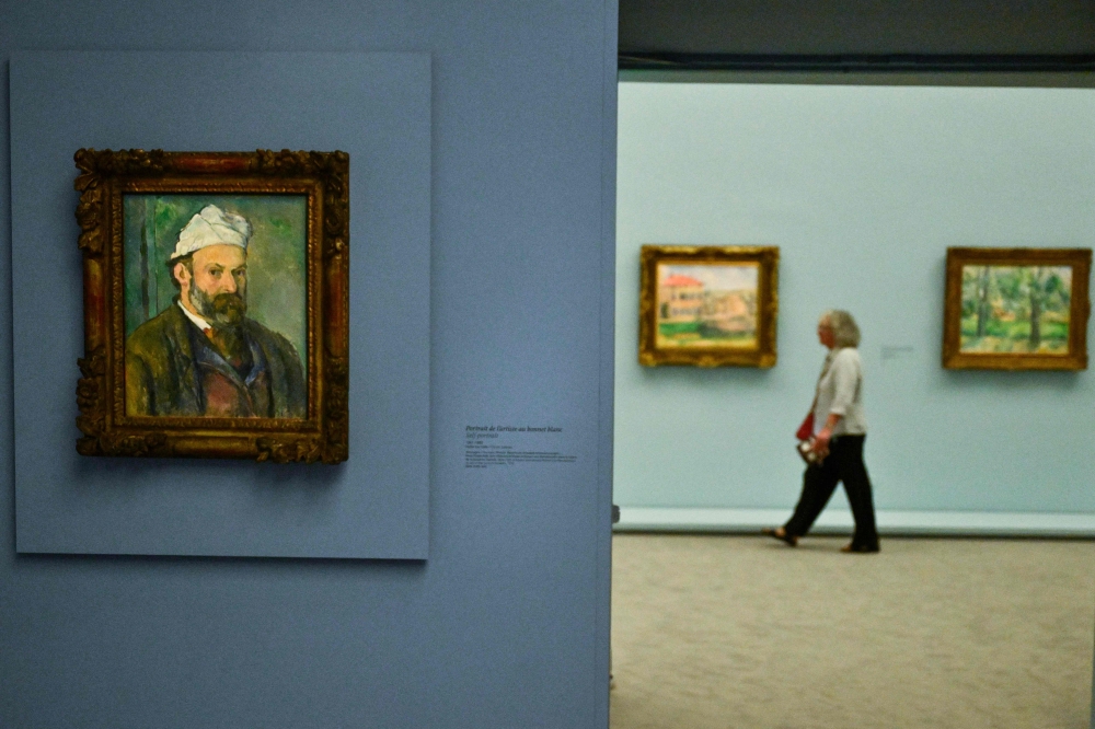 The international exhibition titled ‘Cezanne at Jas de Bouffan’ features more than 130 paintings by French impressionist painter Paul Cezanne at the Granet Museum. — AFP pic