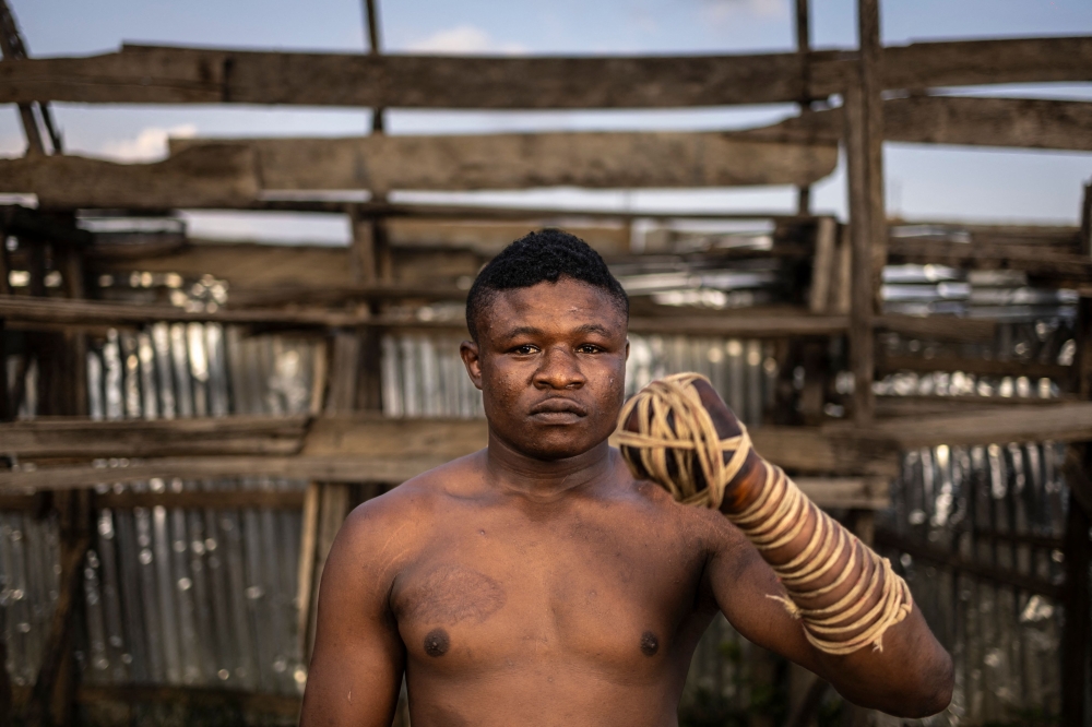 In Dambe, in lieu of a glove, the fighters each have one fist tightly bound in rope — their striking arm. — AFP pic