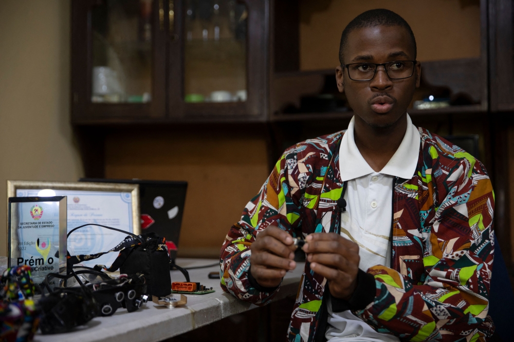 Smart glasses prototypes invented by 24 years old robotics student Joao Antonio Rego (right) are displayed at his house in Matola June 14, 2025. — AFP pic
