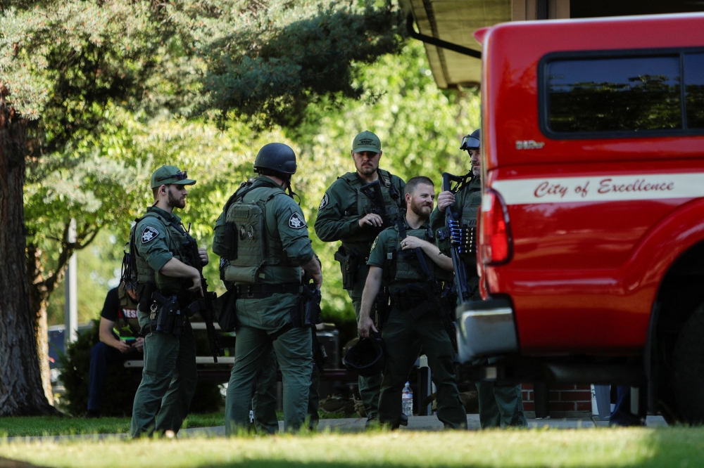 Law enforcement officers gather at Cherry Hill Park after multiple firefighters were attacked when responding to a fire in the Canfield Mountain area outside Coeur d’Alene, Idaho, June 29, 2025. — Reuters pic 