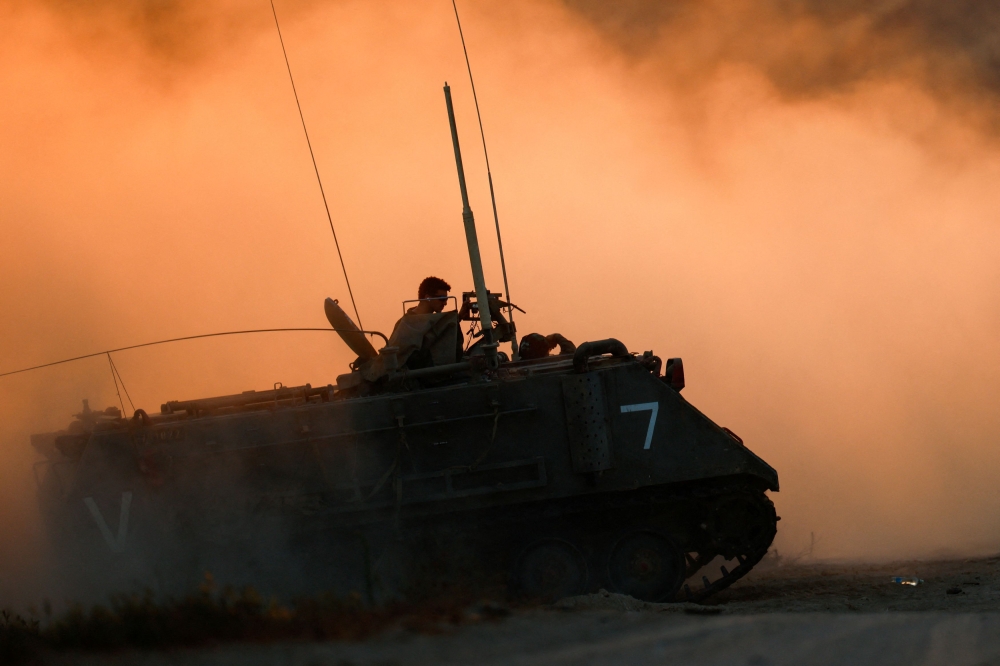 An Israeli military vehicle manoeuvres near the Israel-Gaza Border, as seen from Israel, June 29, 2025. — Reuters pic