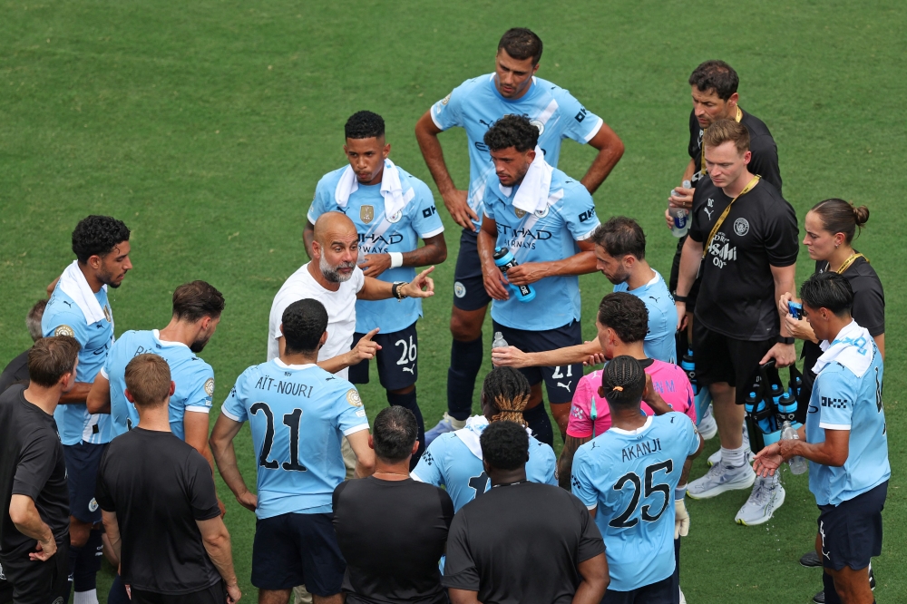Pep Guardiola, Head Coach of Manchester City, speaks with the team during a hydration break during the FIFA Club World Cup 2025 group G match with Juventus FC at Camping World Stadium on June 26, 2025 in Orlando, Florida. — AFP pic