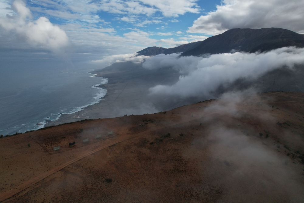 A drone view shows fog catchers, meshes suspended between two poles that intercept small bits of moisture to collect water from the air in the Atacama Desert, in Paposo, Chile June 13, 2025. — Reuters pic  