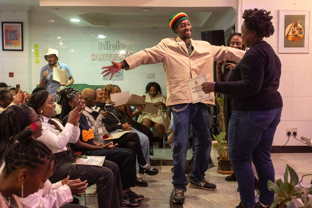 A learner at Disc-jockey (DJ) academy, The Santuri Salon, reacts as he receives his Certificate of Completion from his instructors that follows a four-week intensive DJ101 course held in the basement of a shopping mall in the heart of the Kenyan capital Nairobi on June 20, 2025. — AFP pic